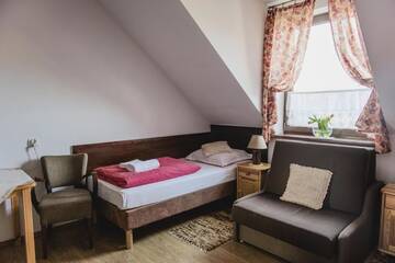 Фото номера Двухместный номер с 2 отдельными кроватями и общей ванной комнатой Фермерские дома Agroturystyka Oświęcim г. Skidzin 2